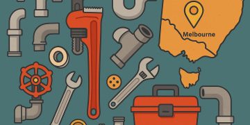 Plumber using wrench to fix kitchen sink in Melbourne home with DIY tools on countertop