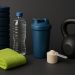 Fitness gear, water bottle, towel, and healthy snacks arranged for post-workout recovery tips