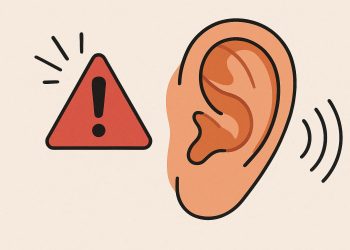 Close-up of an ear with warning icons highlighting potential hearing health issues