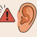 Close-up of an ear with warning icons highlighting potential hearing health issues