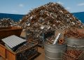 Piles of sorted scrap metal ready for recycling at a Melbourne recycling facility