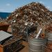 Piles of sorted scrap metal ready for recycling at a Melbourne recycling facility