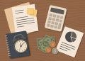 Accounting reports and budgeting documents on a desk representing small business financial planning
