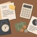 Accounting reports and budgeting documents on a desk representing small business financial planning